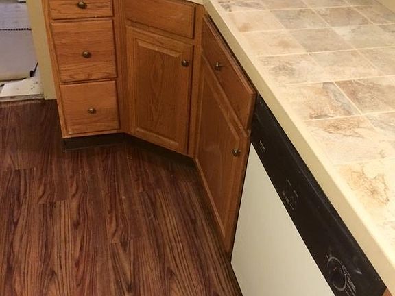 updated flooring and counters in kitchen