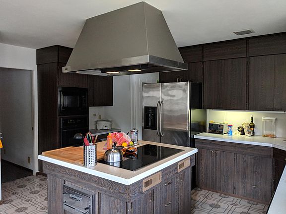 Expanded view of kitchen; plenty of island and counterspace;