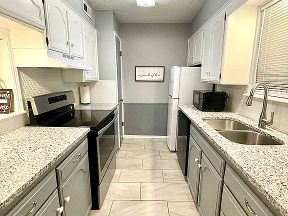 Furnished kitchen with kitchen tools.