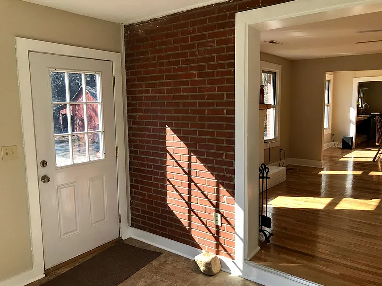 Entrance at front of the house is the door shown on left.