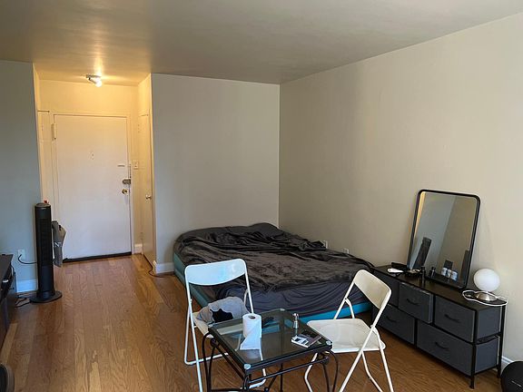 View looking towards entrance (flanked by a closet on each side). Entrance to clothes closet and kitchen entrance which is close to window are on left wall not seen here.