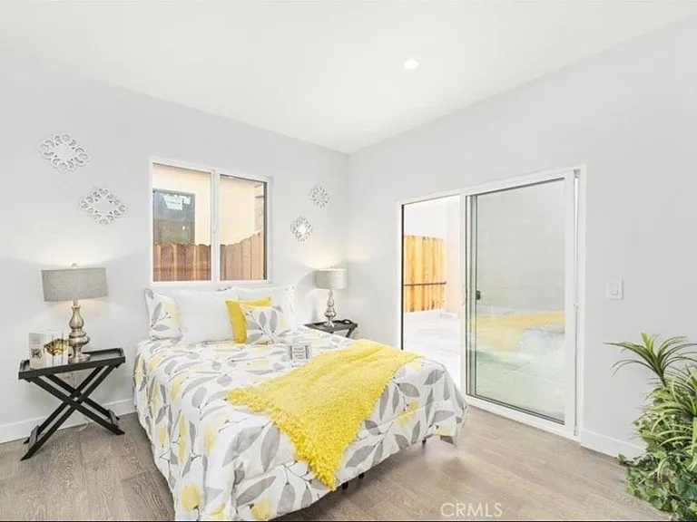 3rd bedroom with sliding door leading out to back patio