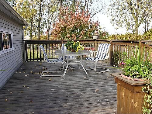Roomy wooden DECK views a vast yard