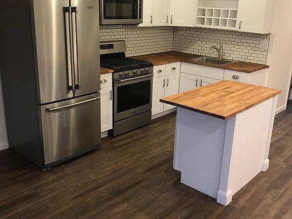 ALL NEW KITCHEN WITH ISLAND HOLD ONE BAR STOOL