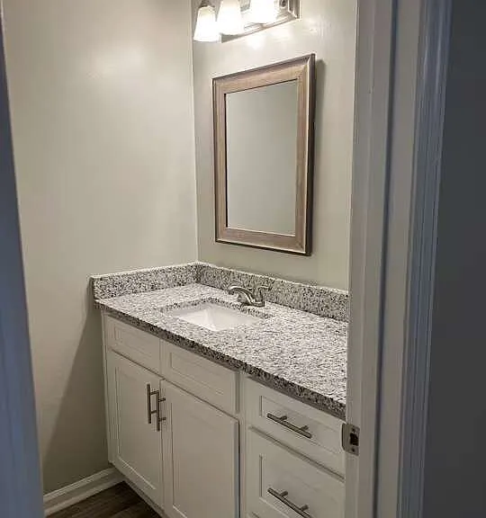 Elevate your living experience at Arbor Terrace with this beautifully designed bathroom featuring elegant granite countertops and modern fixtures. Enjoy a perfect blend of style and comfort. Schedule your tour today to see it in person!