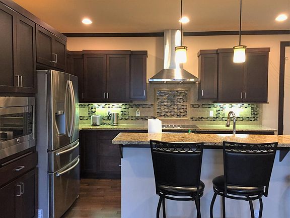High tech kitchen with granite counter, stainless steel smar