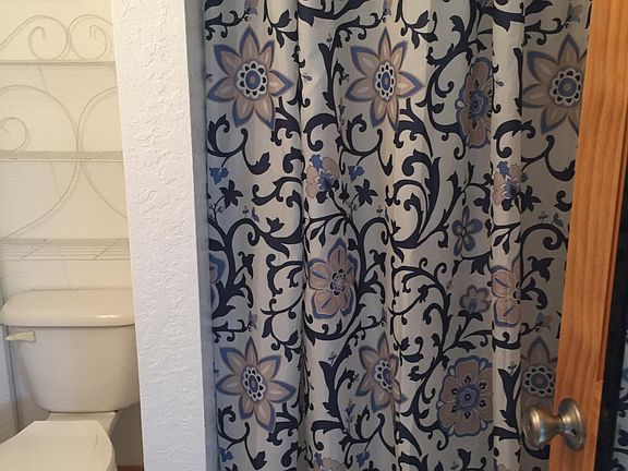 Shower Stall behind curtain