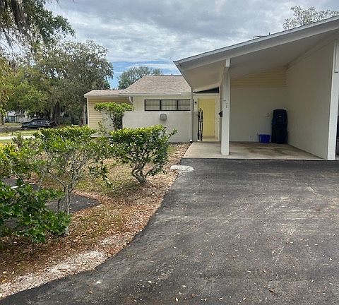 Covered carport and front entrance.