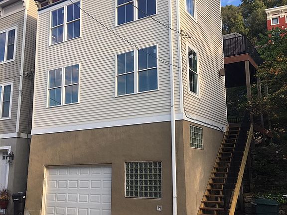 12 foot wide garage door and plenty deep for an SUV. Some residents have used the garage as a hobby and/or exercise space.
