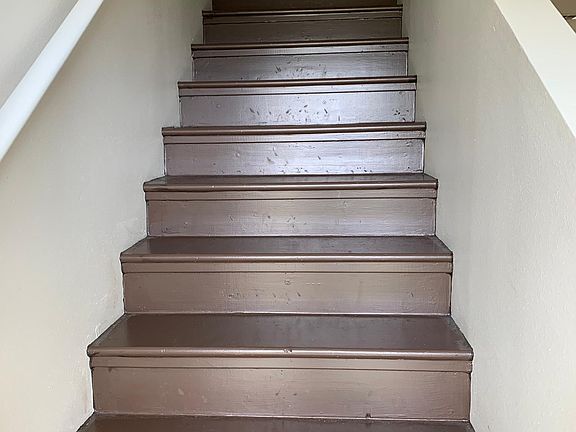 Stairs up to 2 bedrooms and 1 full bathroom.