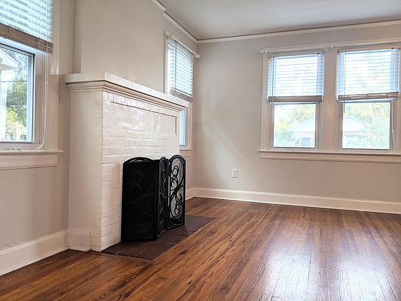 Living Room - custom blinds and curtain rods throughout