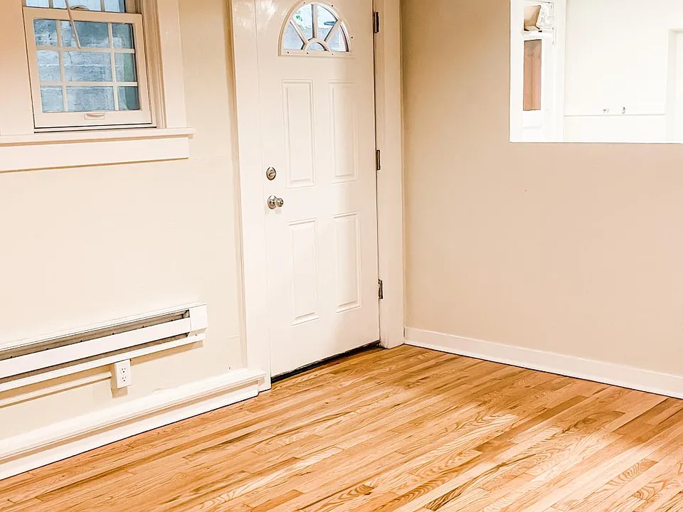 Living Room with open window to kitchen.