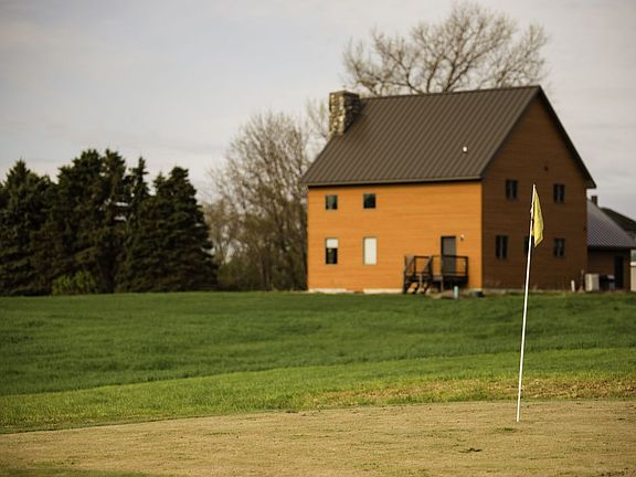 putting green and house