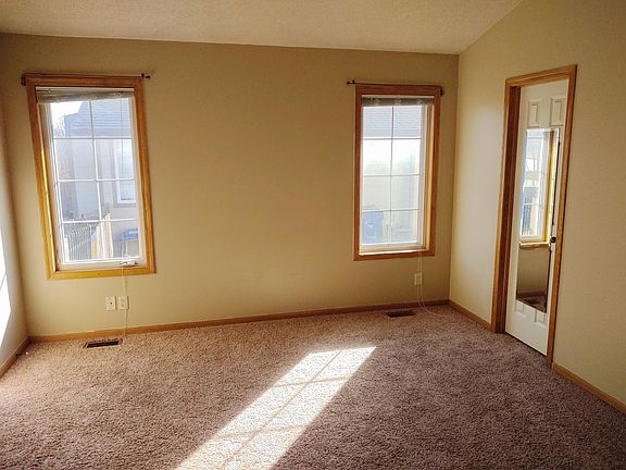 Master bedroom with door to bathroom on the right