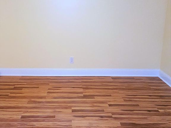 Living room with Pergo wood-flooring and mid-century chandelier
