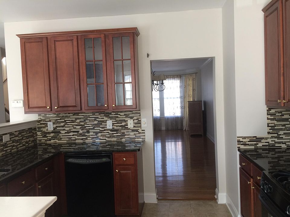 Spacious Kitchen - 1st floor. Appliances include refrigerator, oven, microwave, dish washer. Plenty of cabinets and pantry room. Newly installed marble counter top with backsplash Plenty of sunshine during the day in the breakfast area.
