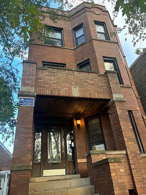 vintage brick facade with newer windows.