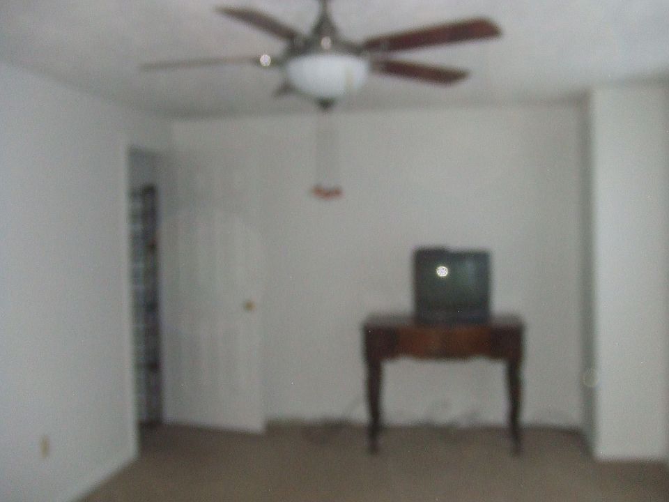master bedroom with walk-in closet