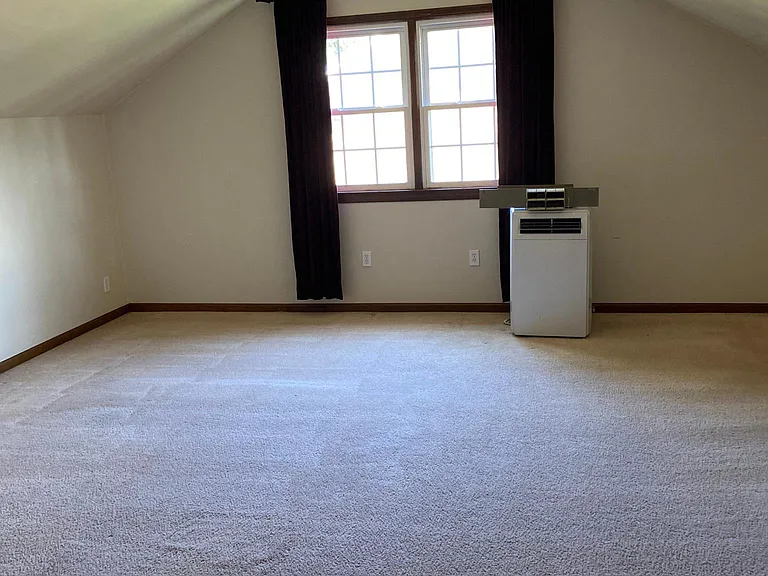 Finished room over garage. Bonus room or 5th bedroom. A favorite among teenagers.