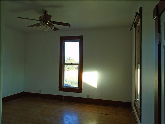 Main level master bedroom w/hardwood floors, freshly painted walls.