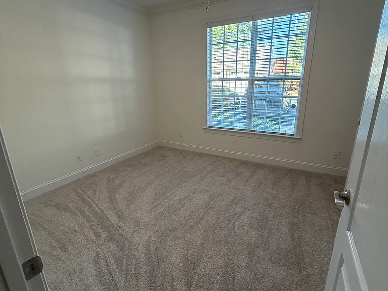 secondary bedroom with walk-in closet