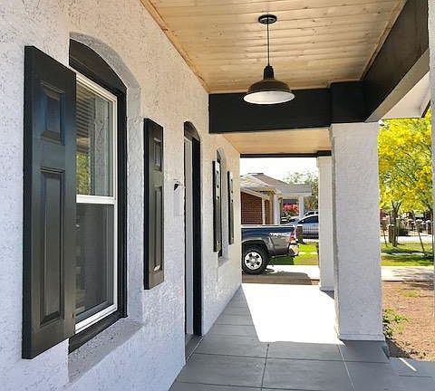 Fantastic covered front port with tongue and groove wooden c