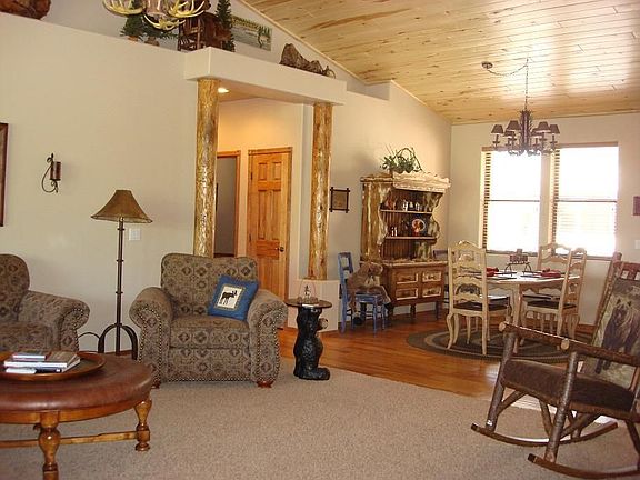 Great Room/Dining Room with high cedar plank ceilings and decorative niches