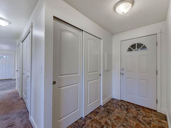 Front door on the left, back door on the right, storage closet