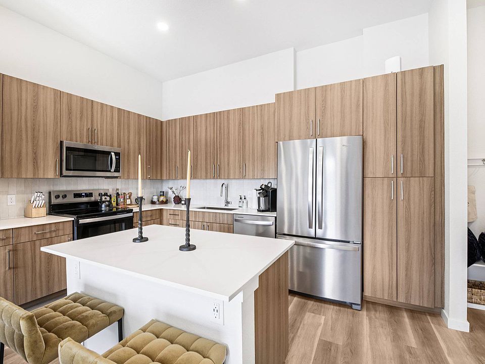 Quartz countertops with designer tile backsplashes at The Madison & The Fillmore