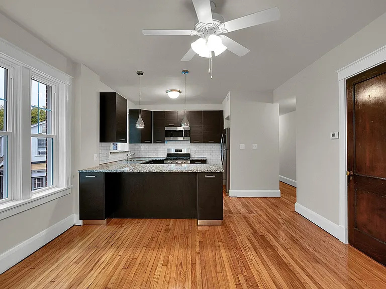 Kitchen breakfast bar. Looking from the family room.