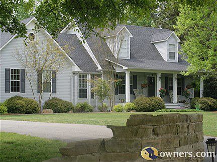 front side of home with a slight view of rock entrance