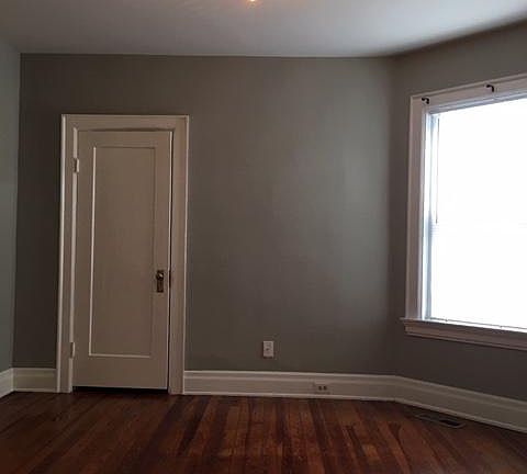 Room 2. Wood floors, closet and large window. Original trim.