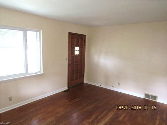 Living room looking toward the front door and front window.