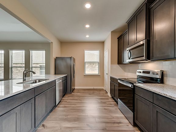 The kitchen comes with a full suite of energy-efficient appliances