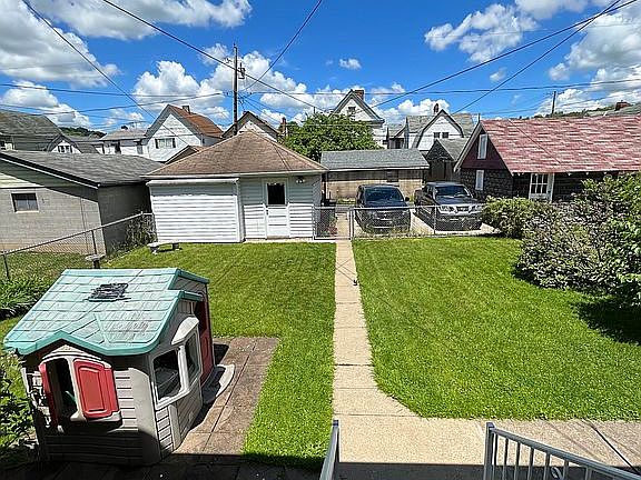 Back yard with 2 car garage.