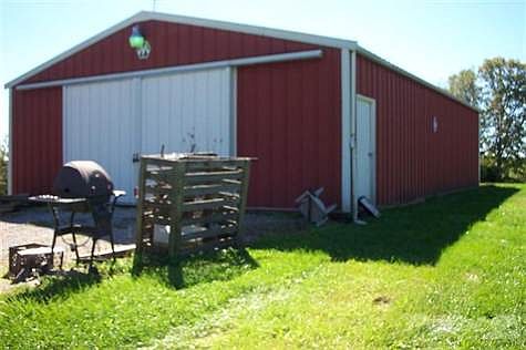 Large garage/barn at back of home.