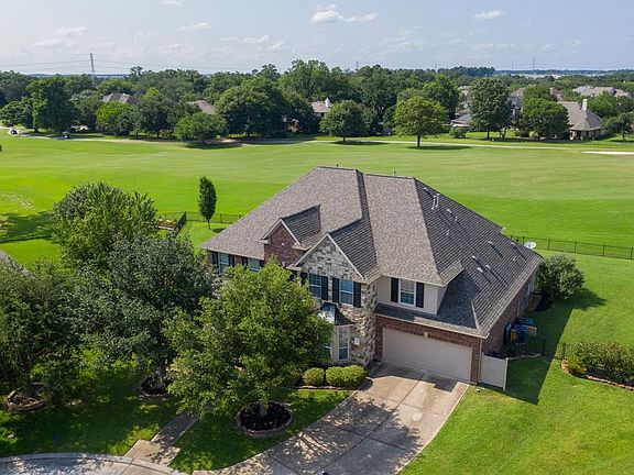 Located at the end of a small cul-de-sac street and backing to the Windrose Golf Club this home has amazing views.