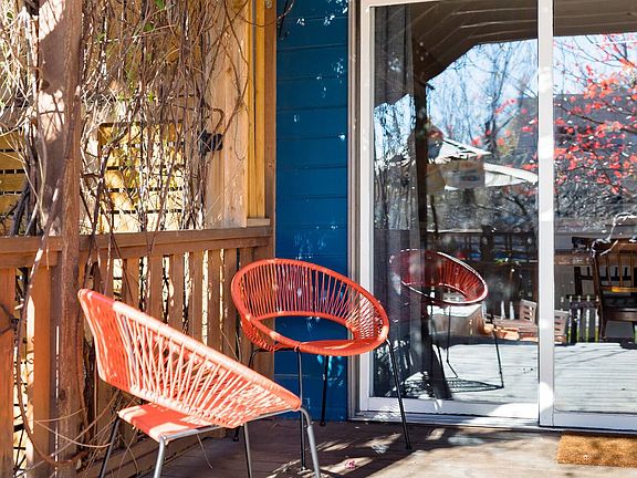 Pergola Covered Deck, Sliding door leads into dining area in kitchen