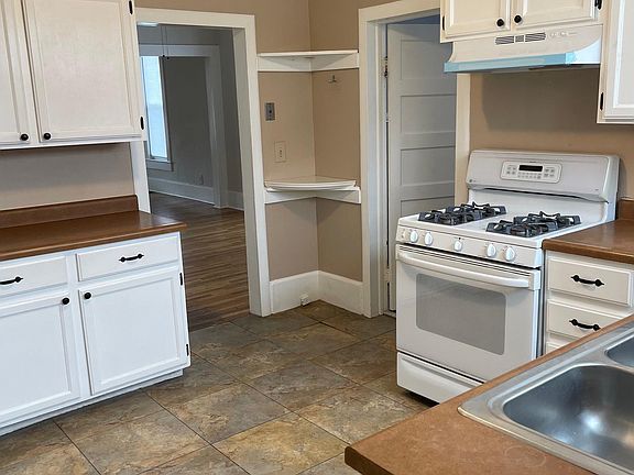 Cute kitchen with fresh cabinet liners and new hood.