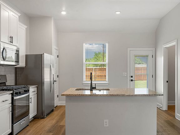 The beautiful kitchen has a large window that lets in great natural light.
