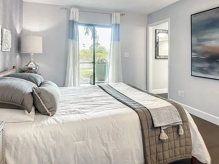 Elevate your living and step out from elegance into tranquility - the Riviera master suite offers direct lanai access, inviting you to unwind amidst the perfect balance fusing sophistication with an alfresco escape.