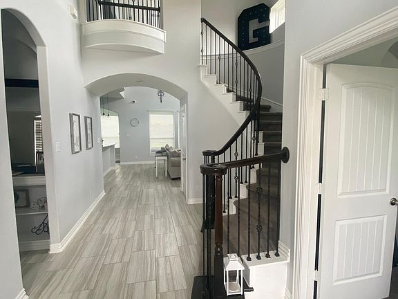 beautiful entry with spiral staircase