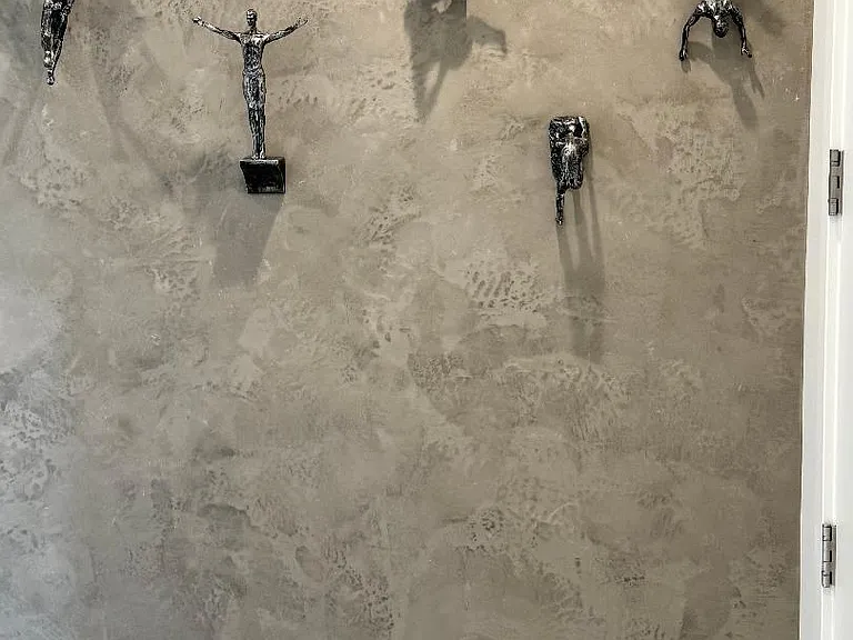 Accent wall with climbers in upstairs hallway leading to guest bedrooms