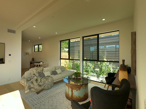 Living room with floor to ceiling windows on both sides
