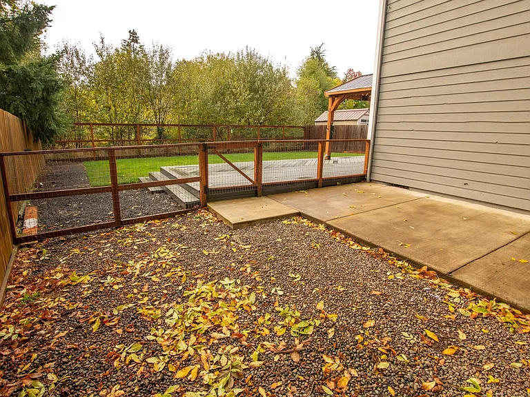 Side yard makes a great, enclosed dog run.