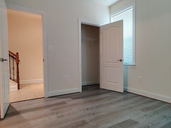 Ground floor bedroom or office with full bathroom and closet.