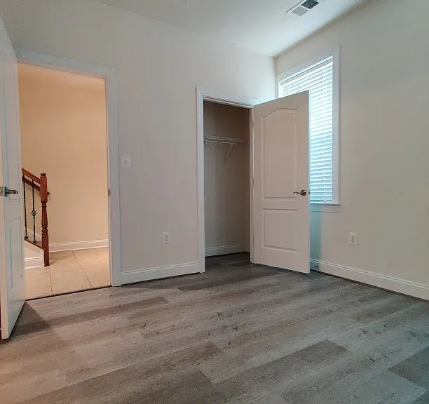 Ground floor bedroom or office with full bathroom and closet.