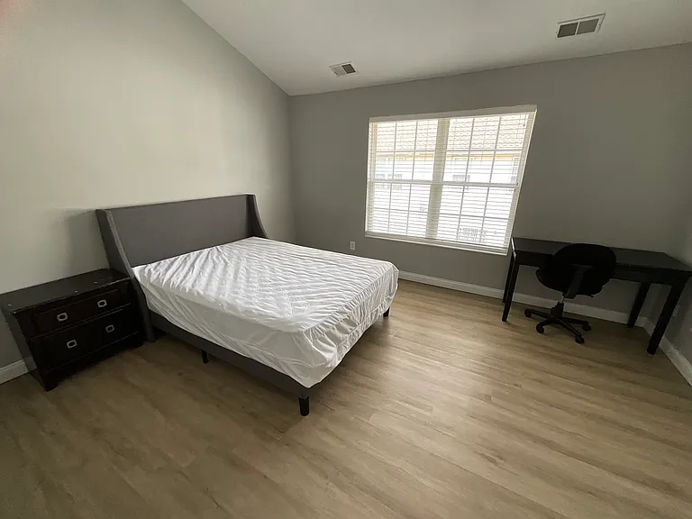 Top floor master #2 with private full bathroom, furnished with items in picture.