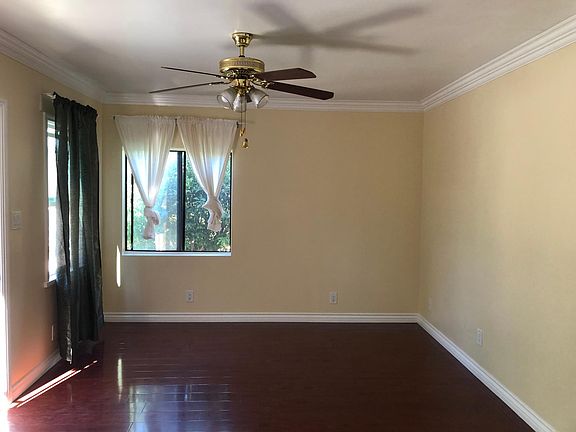 Main living room with ceiling fan