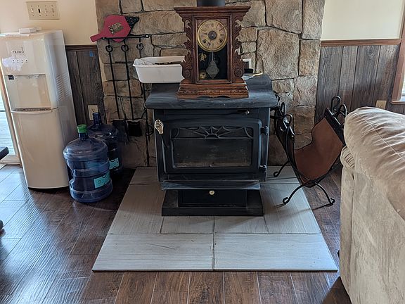COMING SOON ......
Wood stove for those cold winter nights....
A large ceiling fan helps with circulating the wood-burning heat.